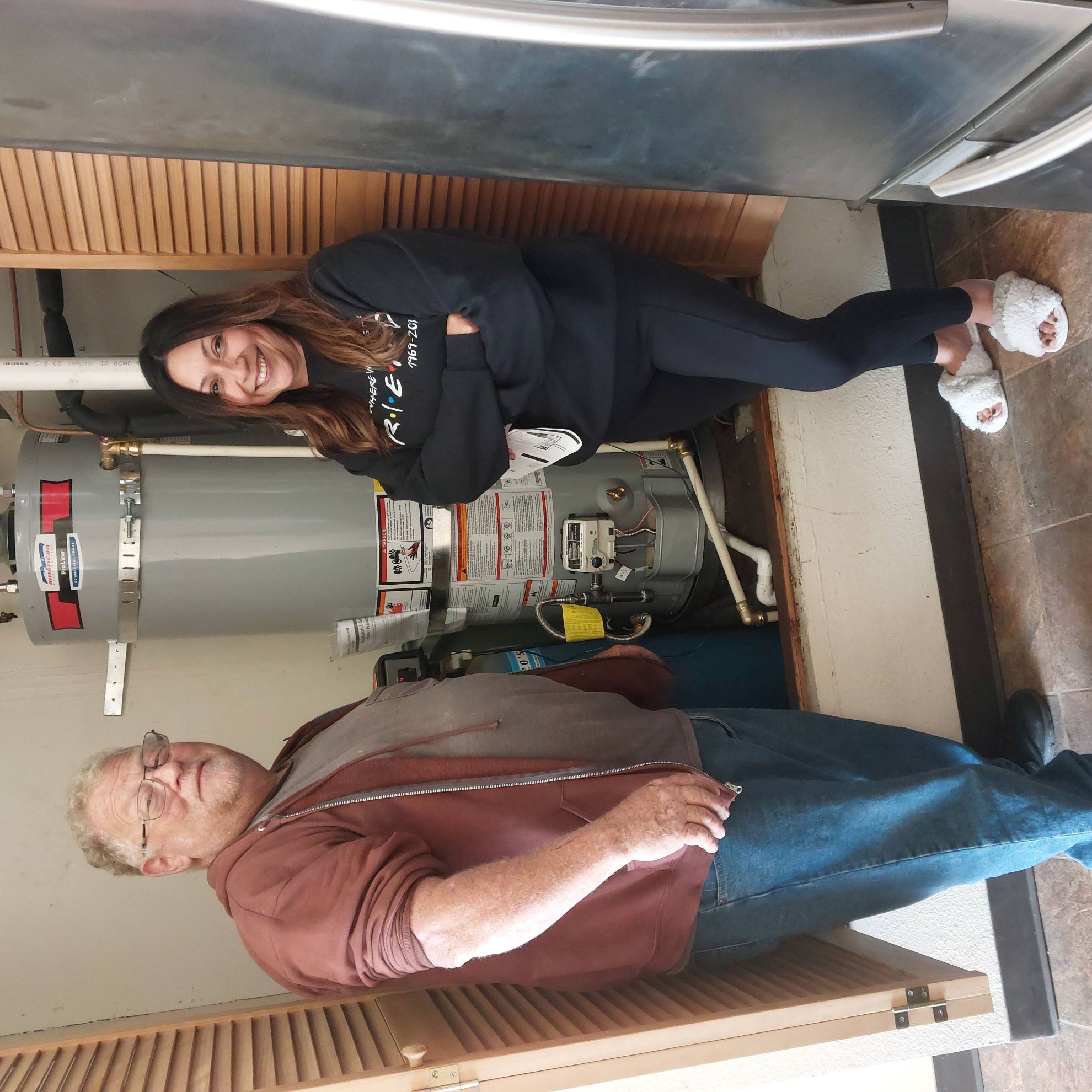 Dave with a customer he installed a water heater for